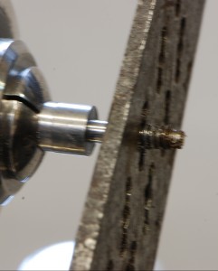 Threading the screw.